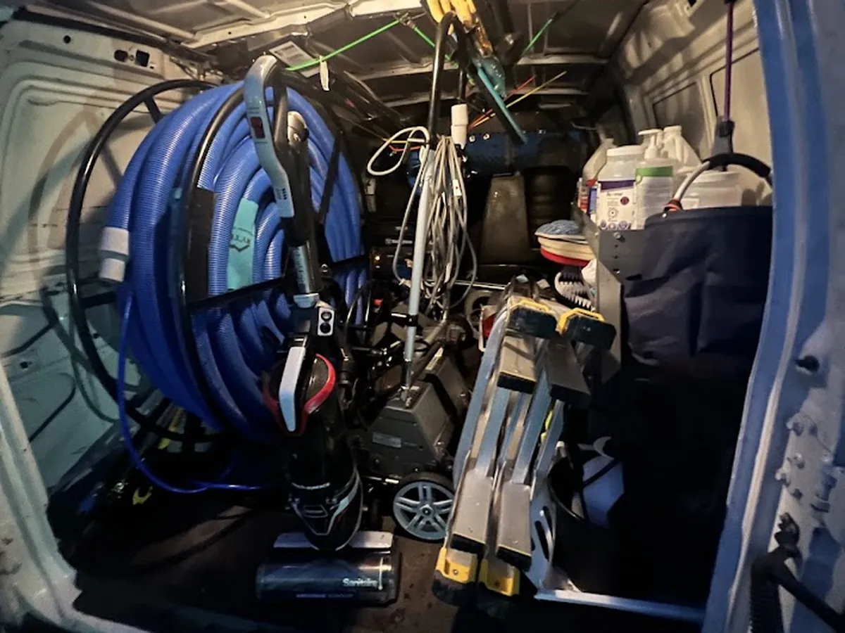 Truck-mount unit and hose reels inside the Sparrow Floor Care van